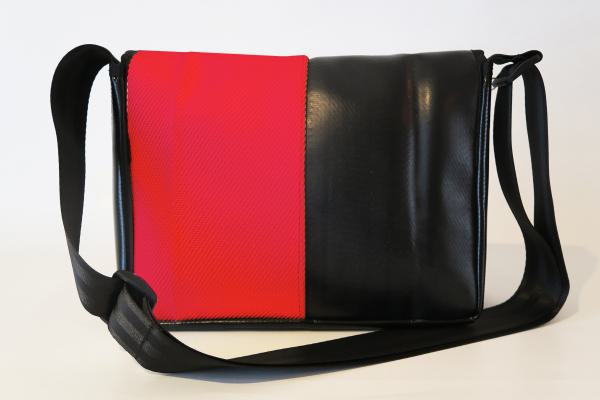 Upcycling Bags made from a used red fire hose and tarpaulin