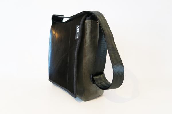 Upcycling bag made from a used tractor hose and amry tent linen
