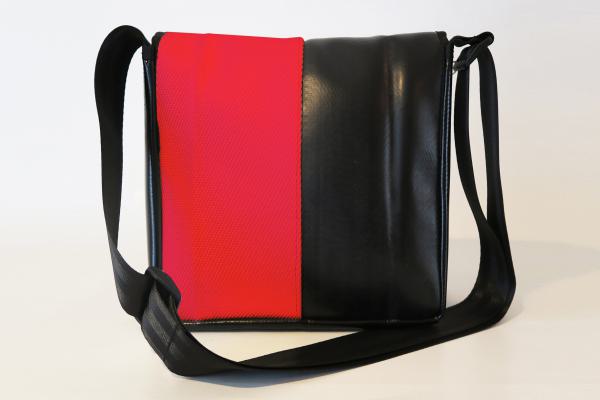 Upcycling Bags made from a used red fire hose and tarpaulin